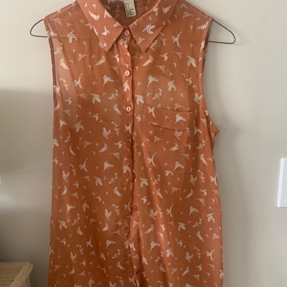 Long button up blouse with cutout back detail